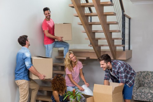 Moving home service in Edgware with packed boxes and furniture ready for transport