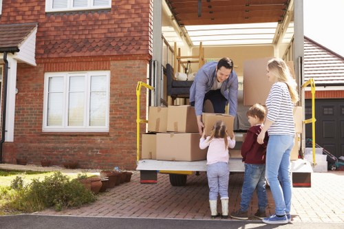 Professional house removalists loading furniture into a van