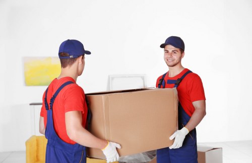 Local movers handling furniture in Edgware street access