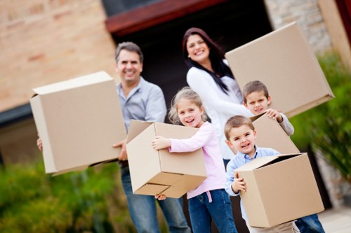 A professional moving team helping customers settle into a new Edgware home