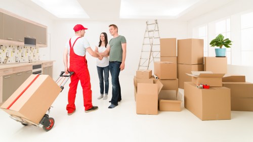 Trained moving staff wearing PPE during a house move in Edgware